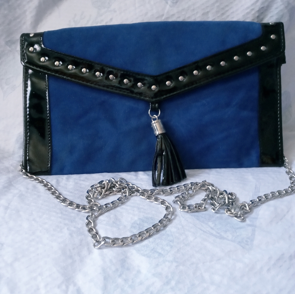 Blue and black large wristlet with a silver crossbody chain